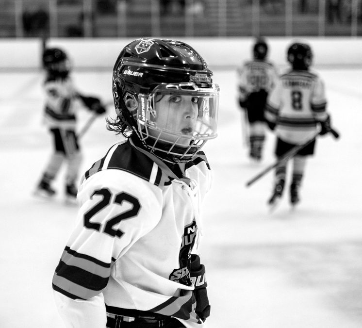 Black-and-white photo of a young hockey player